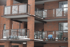 commercial-apartment-building-glass-rail-with-handrail